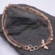 Rose Gold Bee and Gemstone Bracelet, shown on dark grey stone