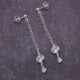 Sterling Silver Cubic Zirconia Dangle Earrings, shown from above on dark slate