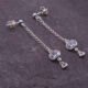 Sterling Silver Cubic Zirconia Dangle Earrings, shown on dark slate