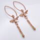 Rose Gold Bee and Gemstone Earrings, shown from above on plain white background