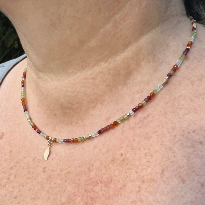 Mixed Metals Gemstone Necklace with Gold Leaf Charm, shown worn by model