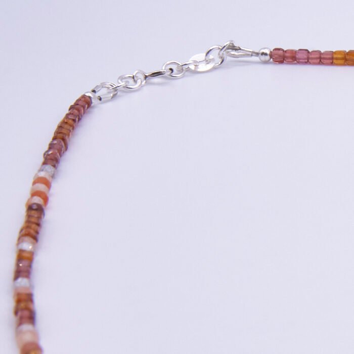 Garnet and Carnelian Gemstone Necklace, image shows close-up of clasp and part of gemstone strand, on plain white background