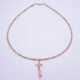 Rose Gold Gemstone and Bees Necklace, shown from above on plain white background