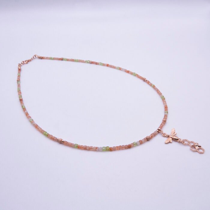 Rose Gold Gemstone and Bees Necklace, shown on plain white background